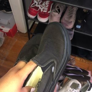 All black slip on vans